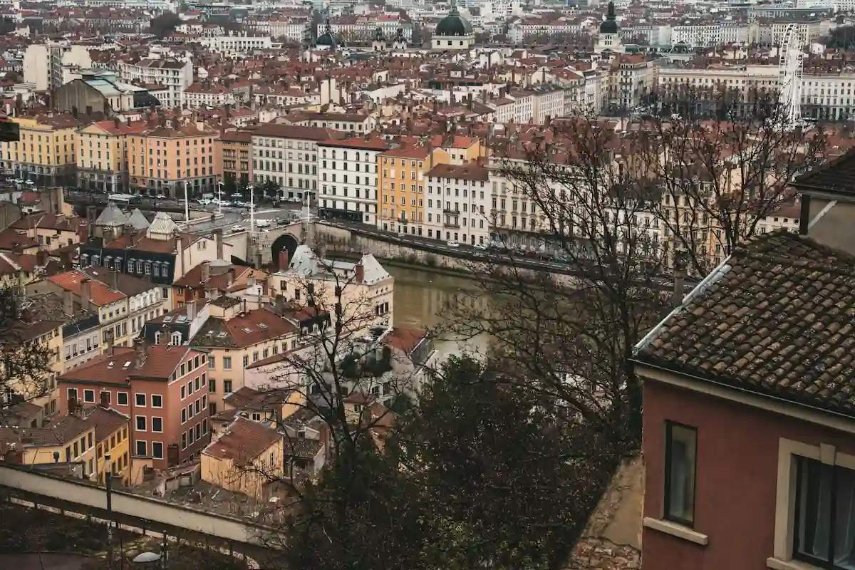 Red rooftops of Lyon's old town along the Saône river, seen from the hill above.