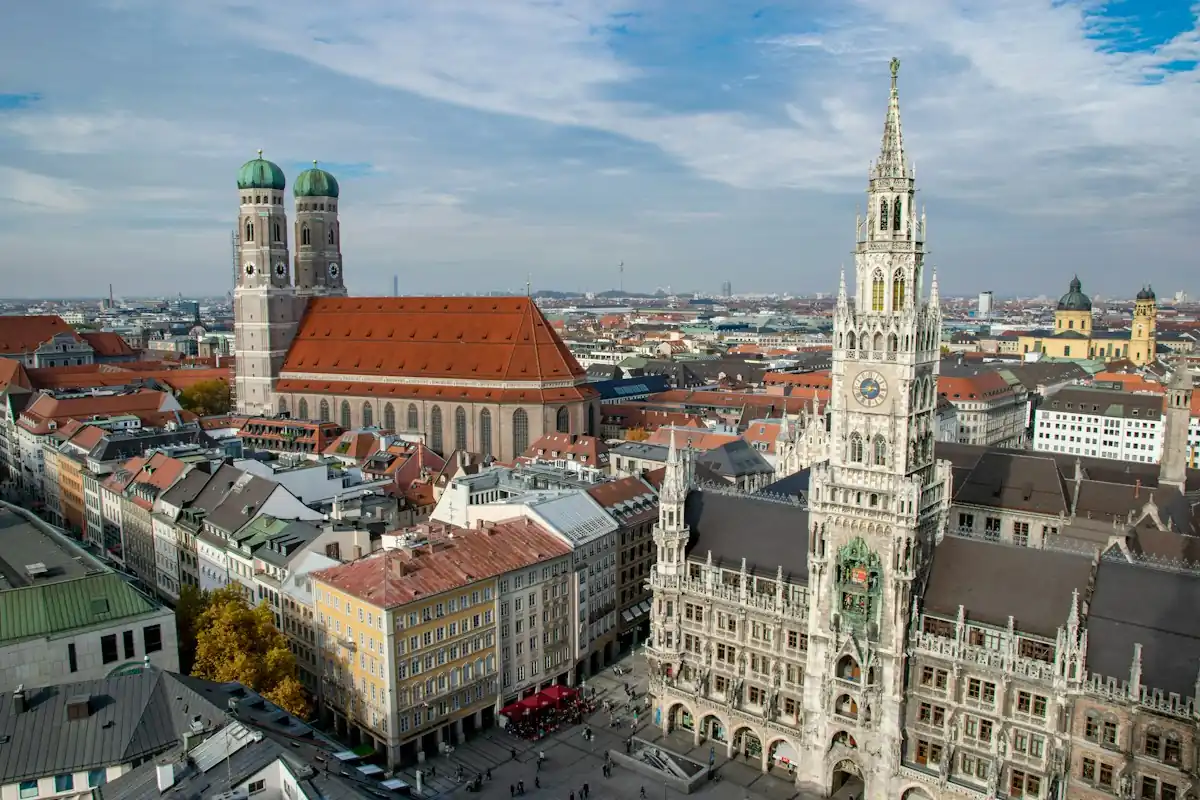 Munich rooftops with the twin towers of the Frauenkirche and the New Town Hall on Marienplatz.